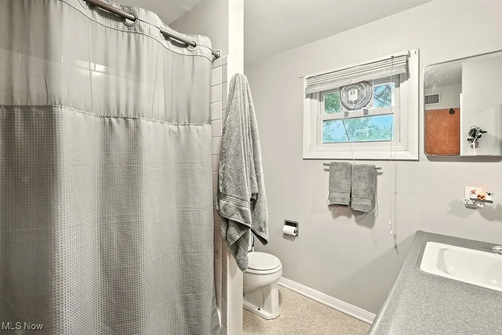Full Bathroom with vanity and a shower with curtain