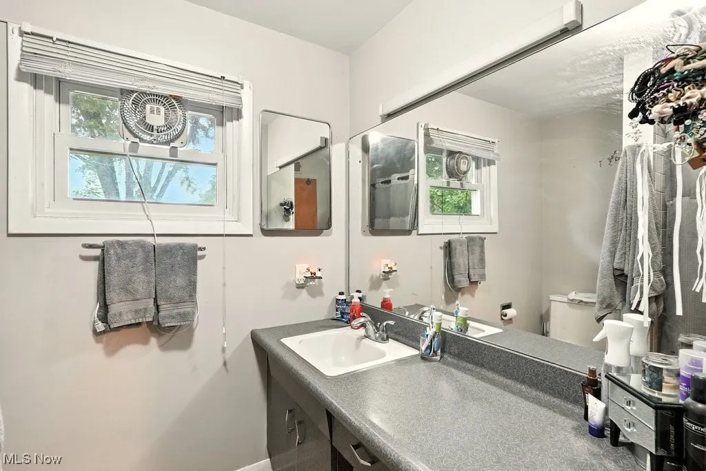 Full bath with toilet and vanity