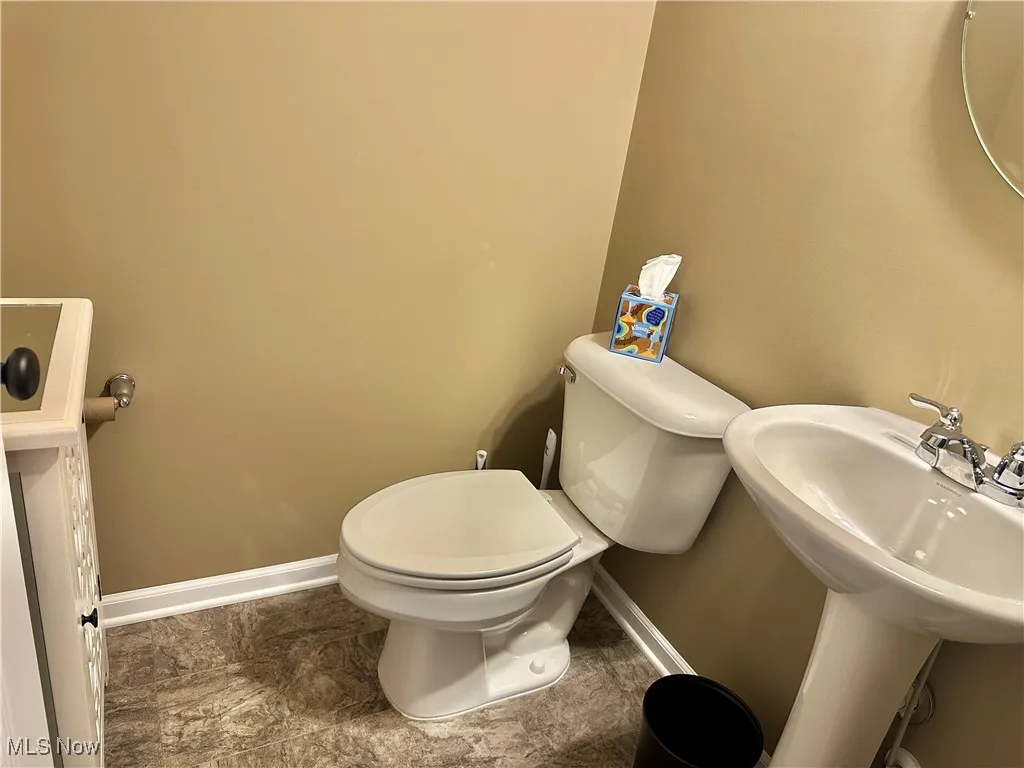 Bathroom with baseboards and toilet