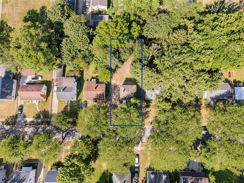 Aerial view of residential area with property boundaries highlighted