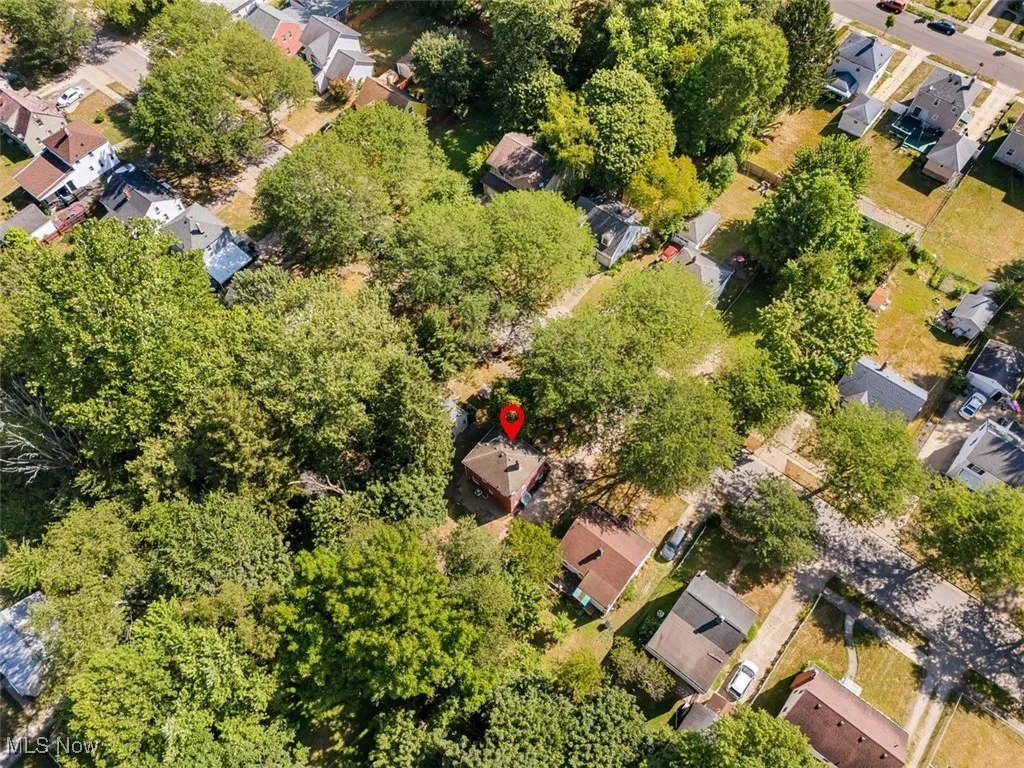 Aerial overview of property's location featuring nearby suburban area