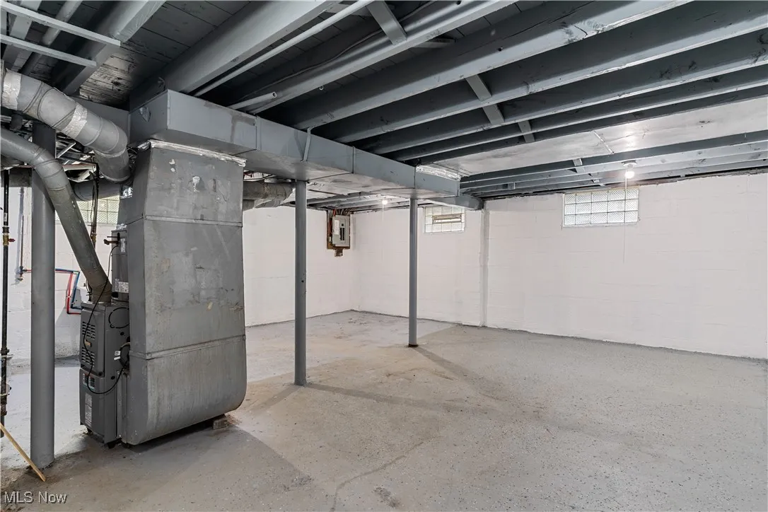 Below grade area featuring heating unit