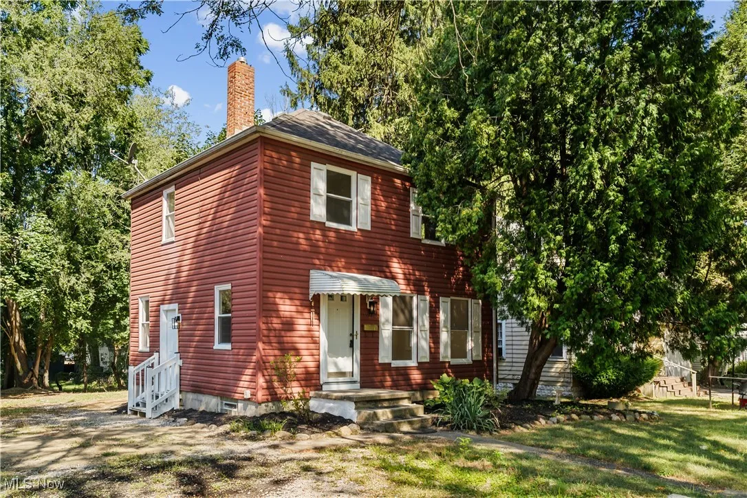 View of front of house featuring a chimney