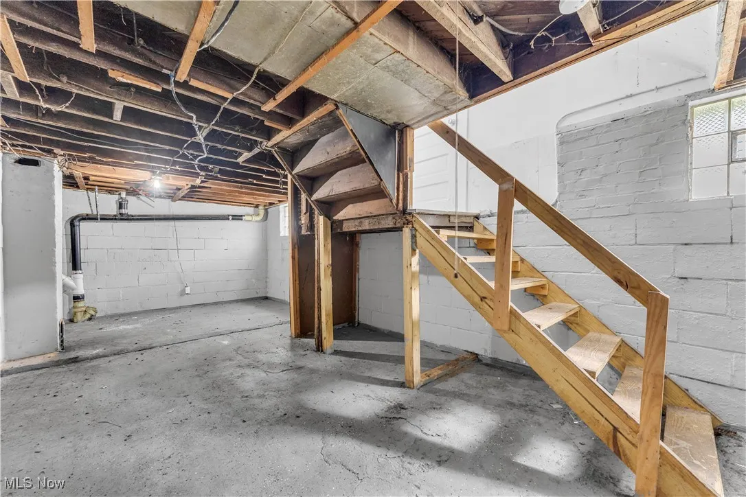Basement featuring stairway