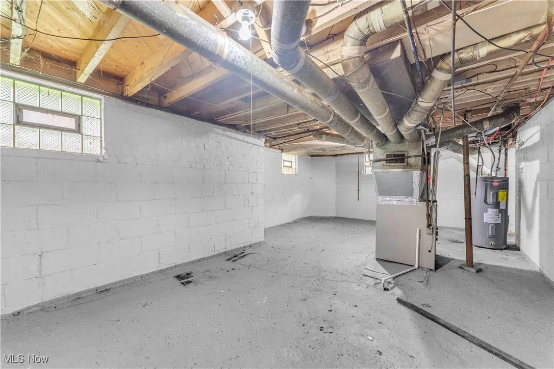Basement with heating unit and electric water heater