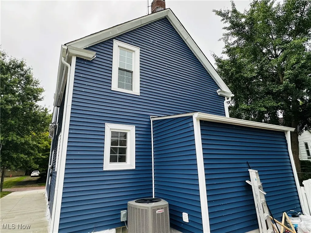 Back of property featuring a chimney