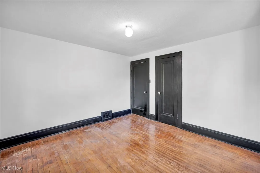 Empty room featuring hardwood / wood-style floors