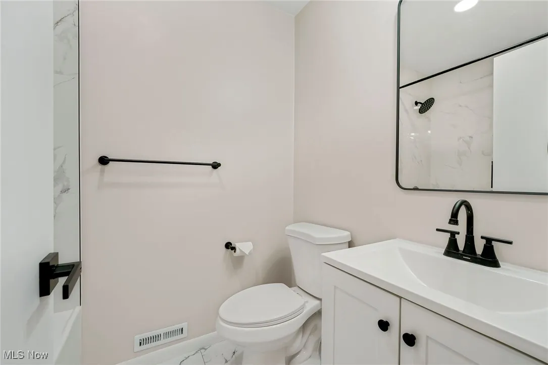 2nd Floor Updated Full Bath with tiled floor and tub/shower combo