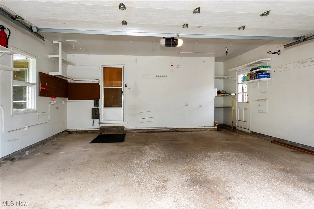 Garage featuring a garage door opener