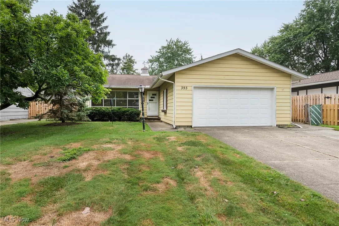 Single story home with an attached garage and driveway