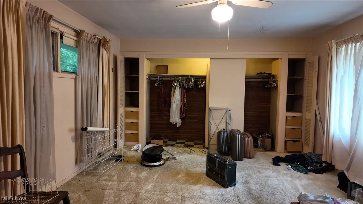 Bedroom featuring a closet, carpet floors, and ceiling fan