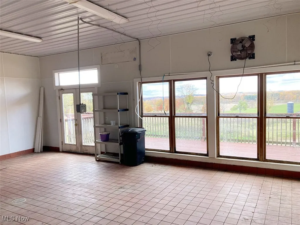 Unfurnished room with french doors