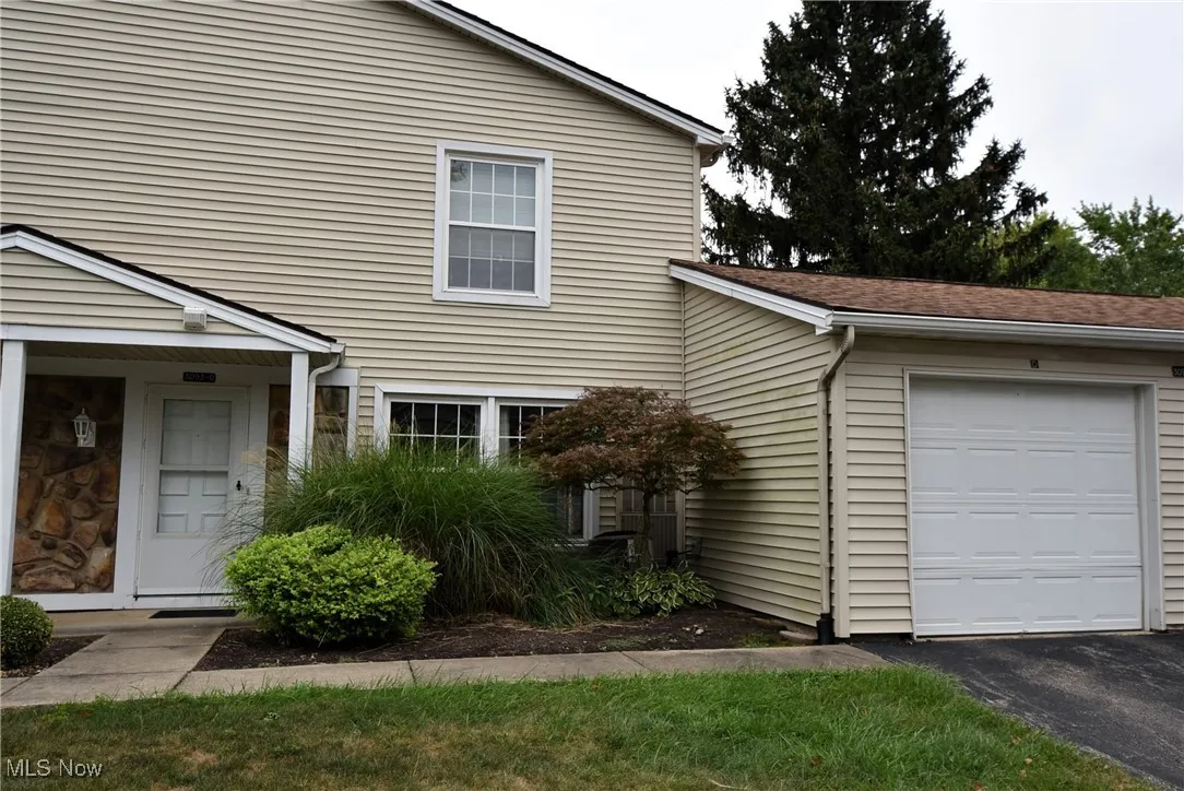 View of front of home with asphalt driveway