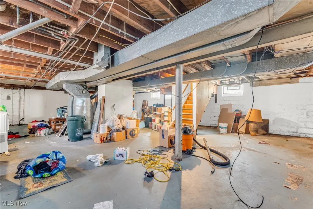 Below grade area featuring stairway and washer / clothes dryer