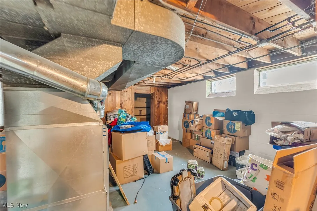 Below grade area featuring heating unit