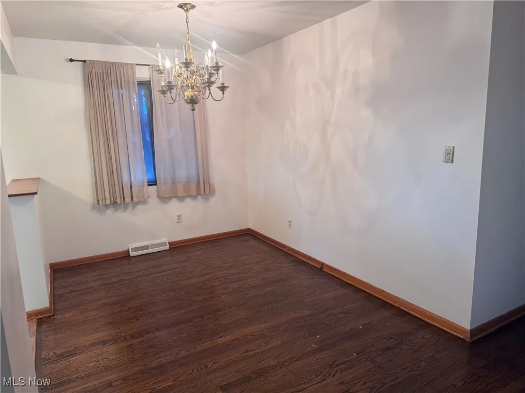 Dining area with hardwood floors.