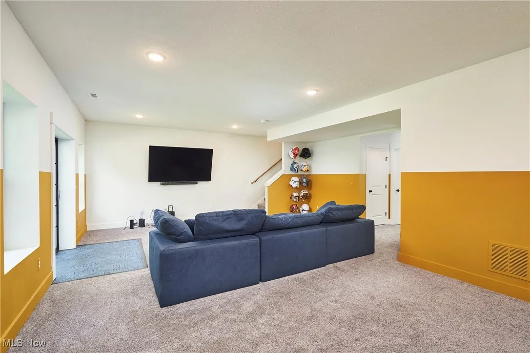 Living room featuring carpet floors and recessed lighting