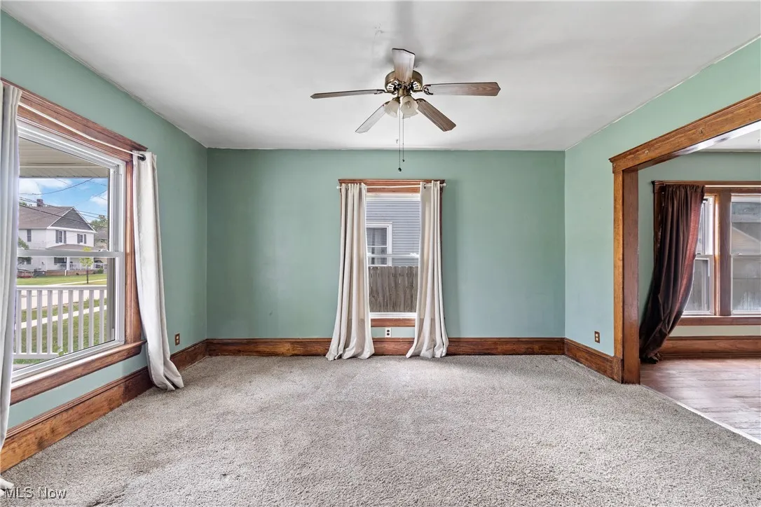 Unfurnished room with carpet flooring and ceiling fan