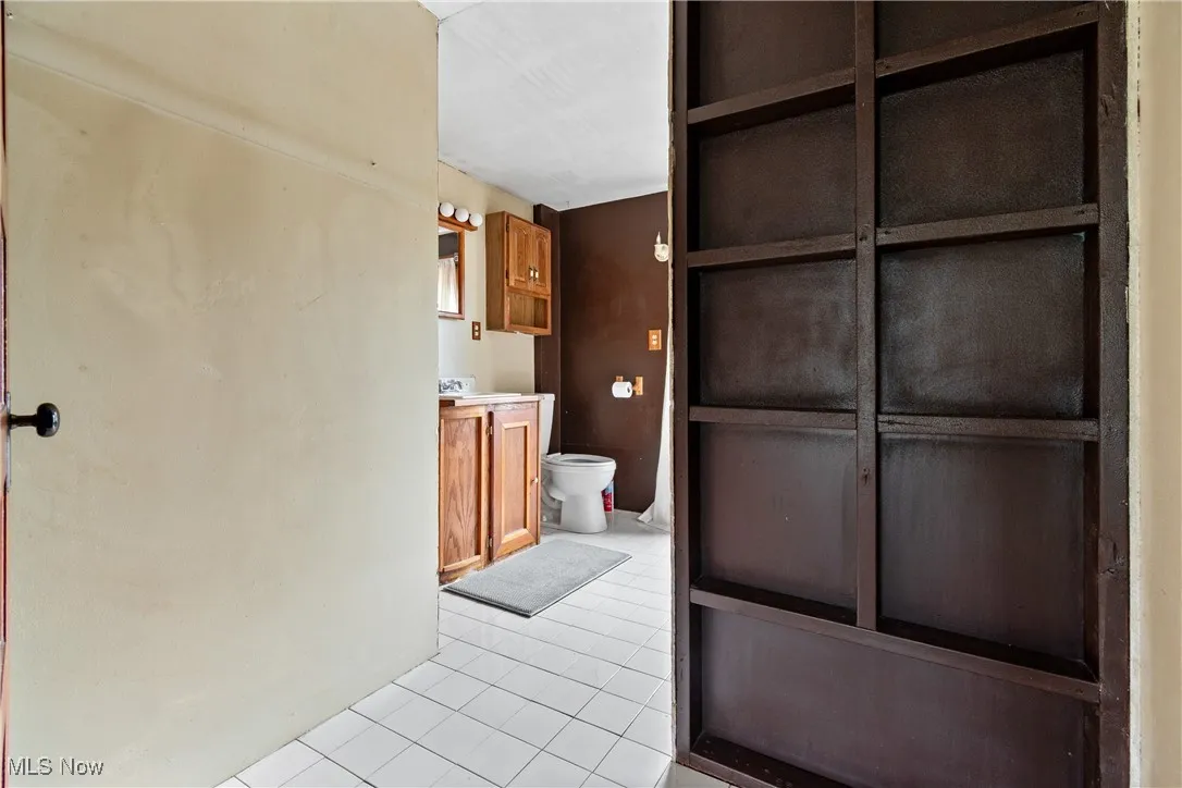 Bathroom with vanity and light tile patterned floors