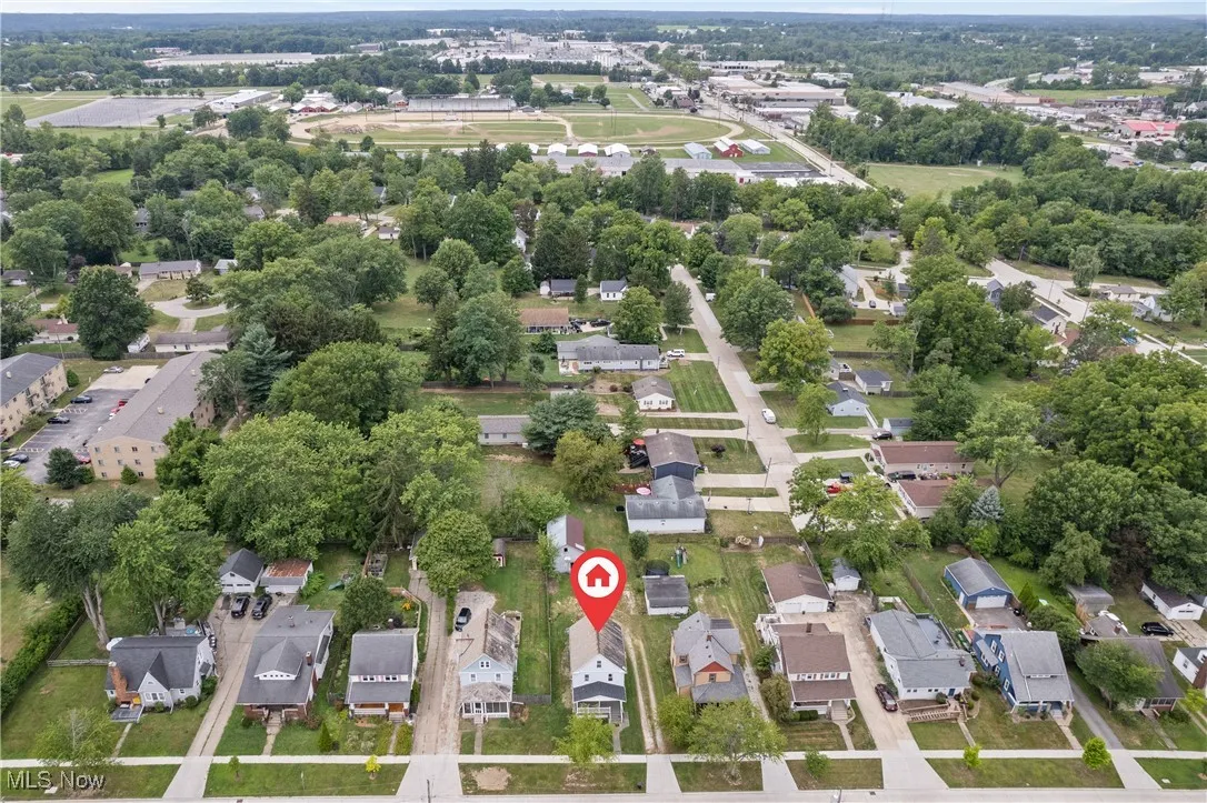 Aerial overview of property's location featuring nearby suburban area