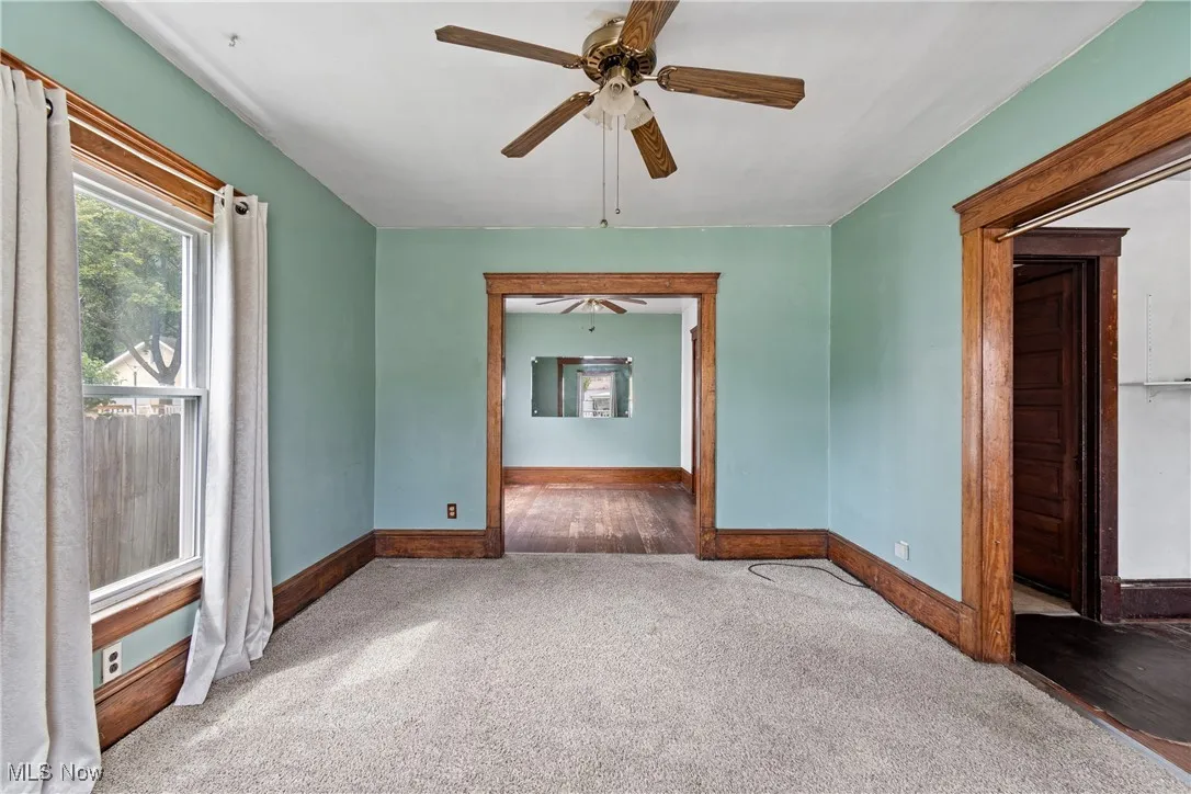 Spare room with carpet flooring and ceiling fan