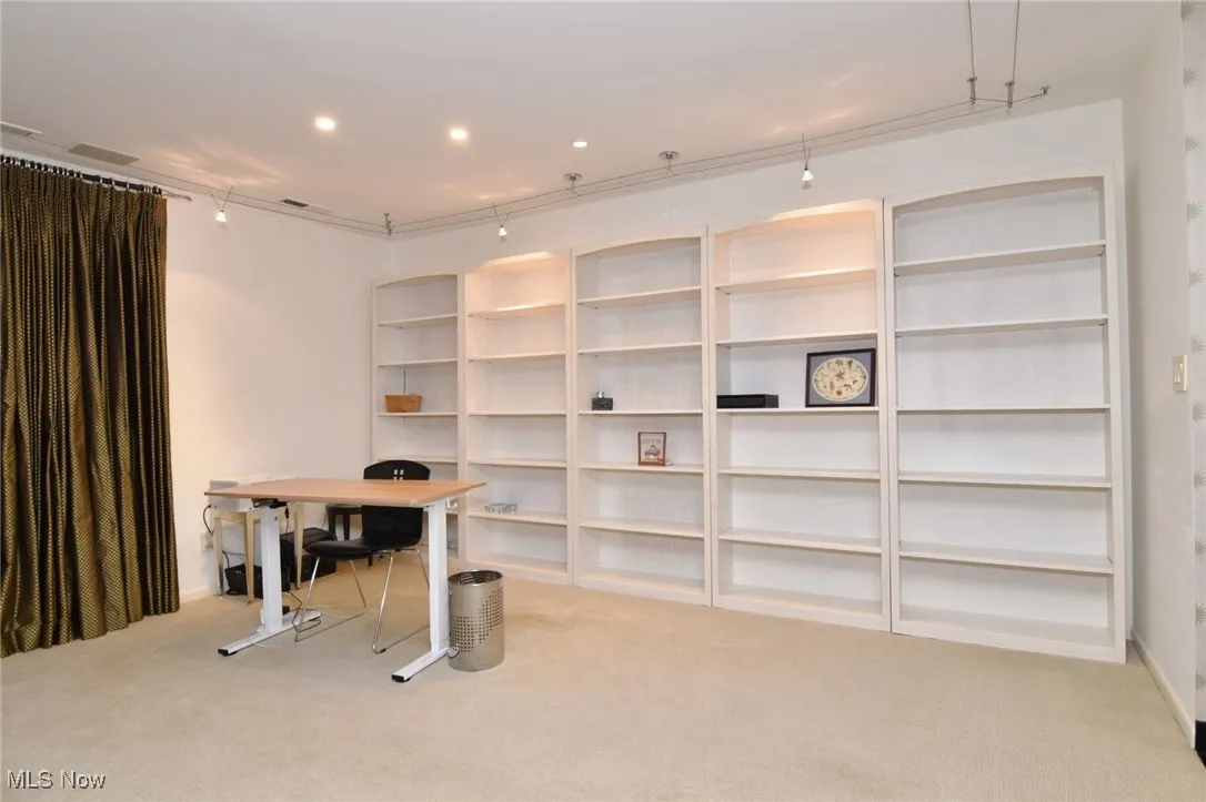 Unfurnished office with light carpet and recessed lighting