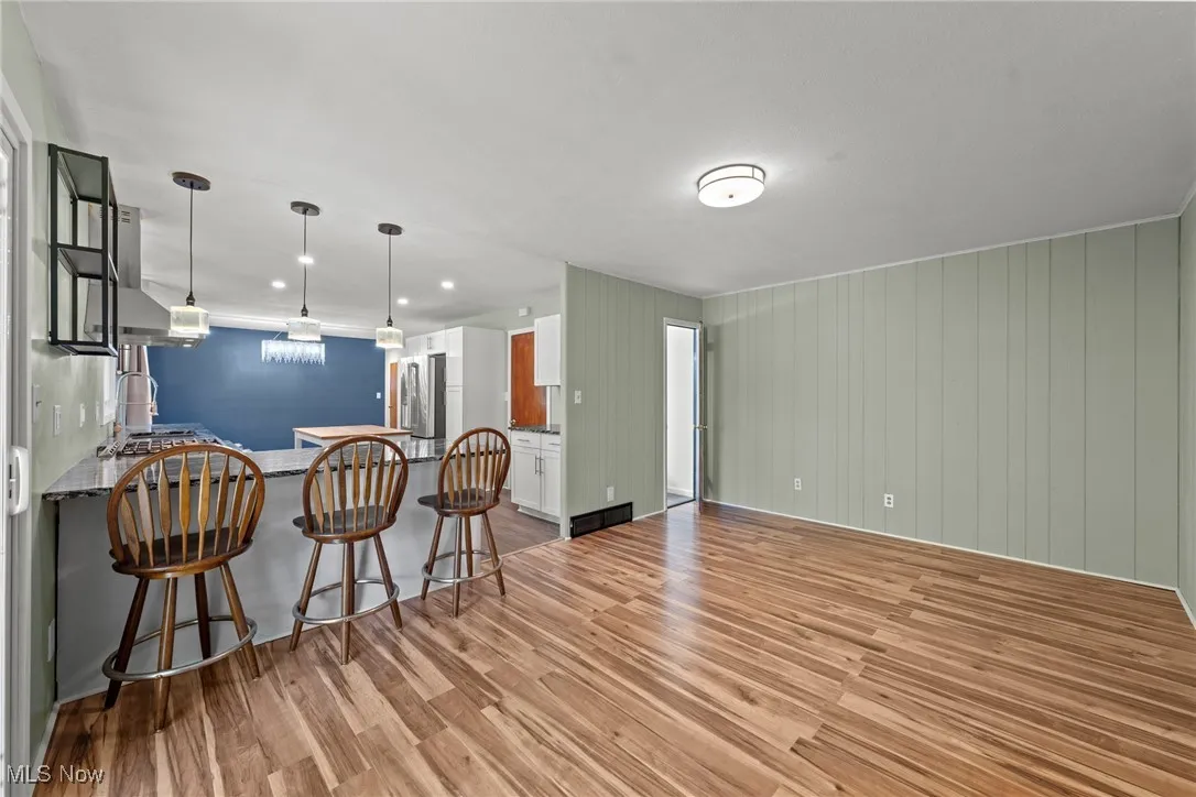 Living room featuring light wood-style floors and recessed lighting
