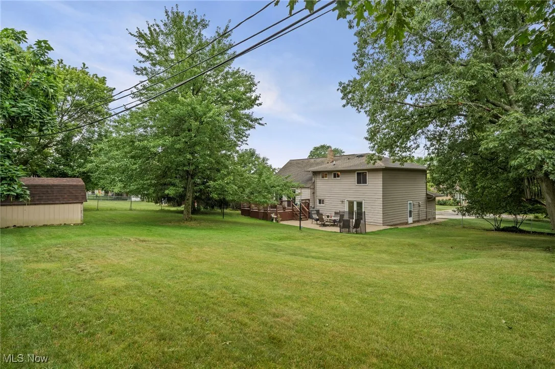 Another view of yard and back of home