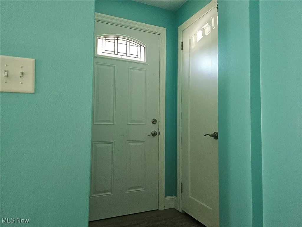 Doorway featuring wood finished floors