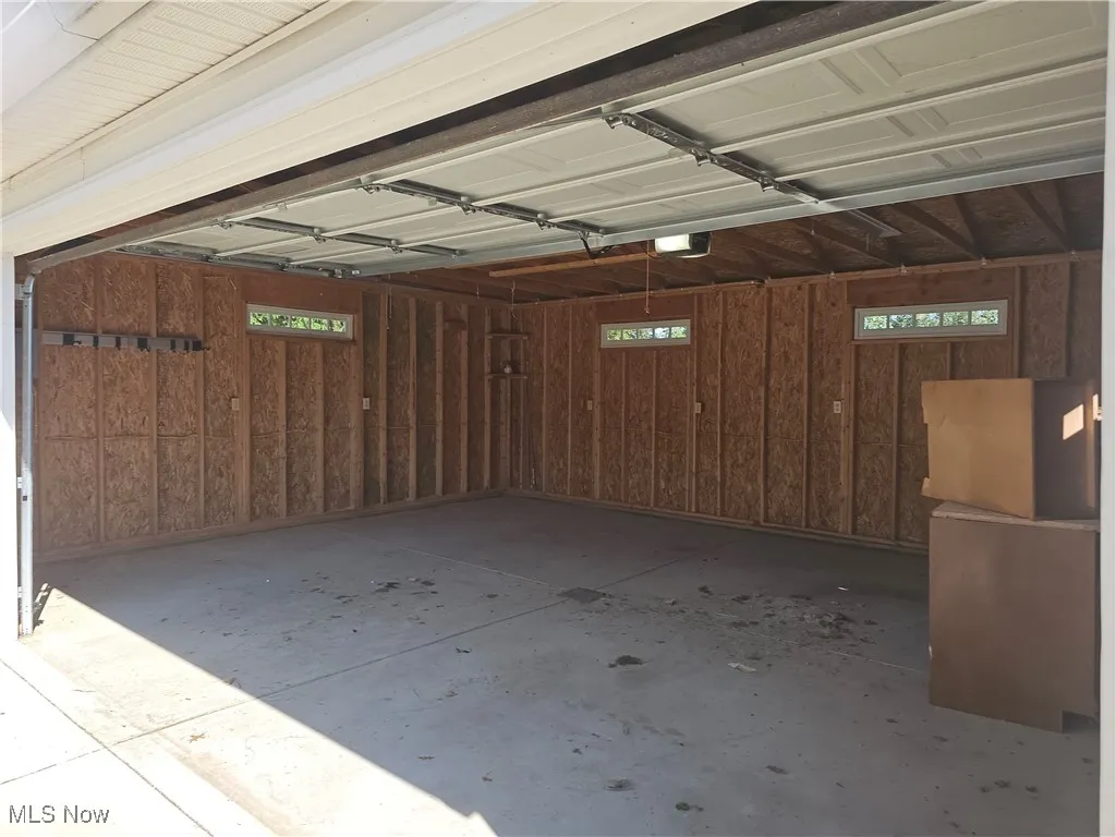 Garage featuring a garage door opener