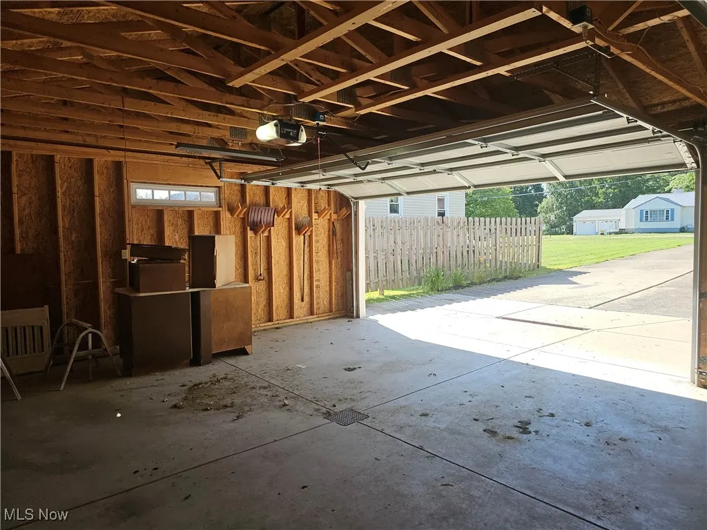 Garage featuring a garage door opener