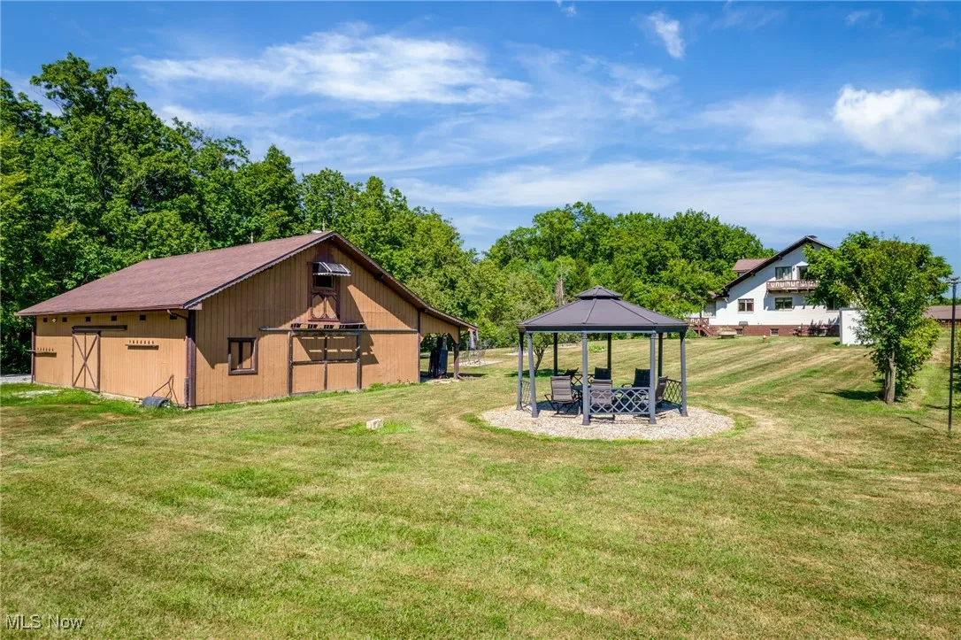 View of green lawn featuring a gazebo