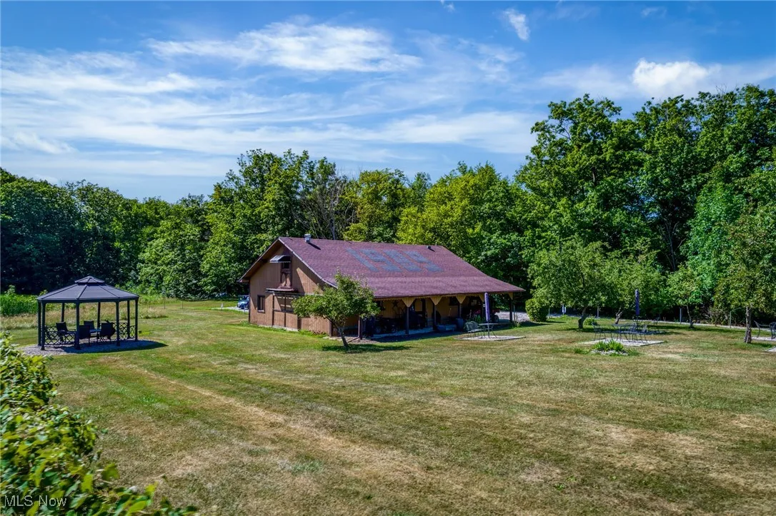 View of grassy yard featuring a gazebo
