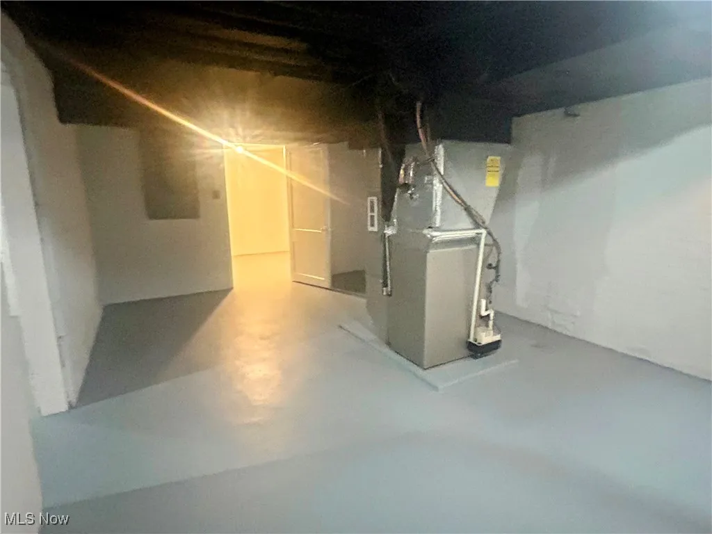 Unfinished basement with heating unit