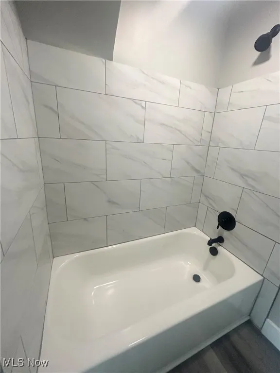 Full bathroom with bathtub / shower combination