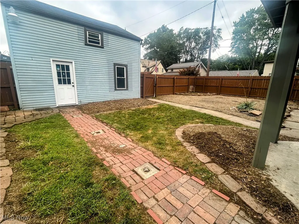 View of fenced backyard