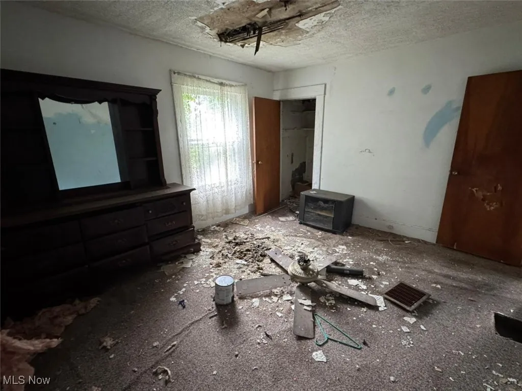 Unfurnished bedroom with a textured ceiling