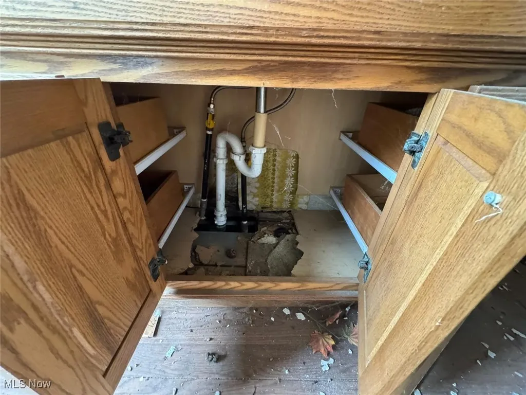 Detailed view of drainage system and wood finished floors