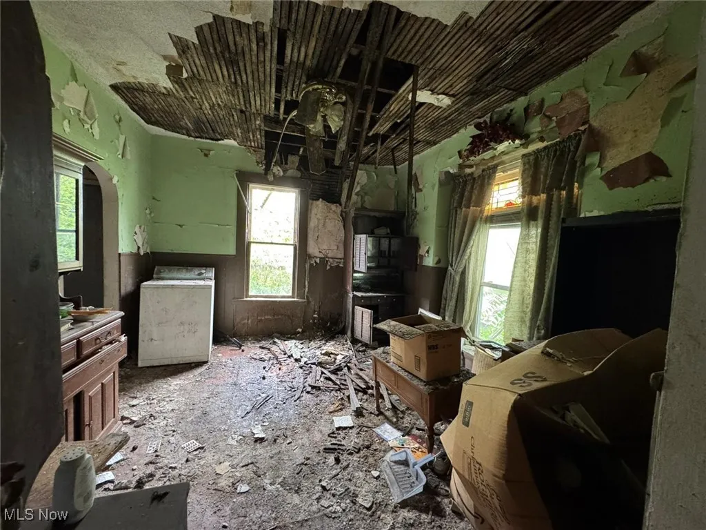 Dining area featuring healthy amount of natural light and washer / clothes dryer