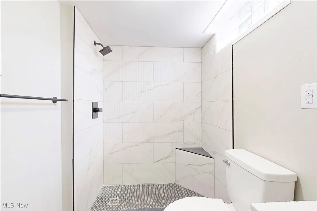 Bathroom featuring a shower stall and vanity