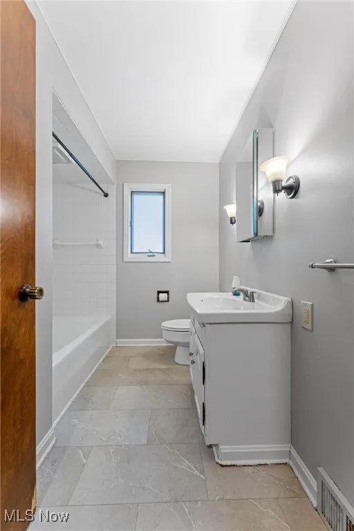 Full bathroom featuring vanity and shower / washtub combination