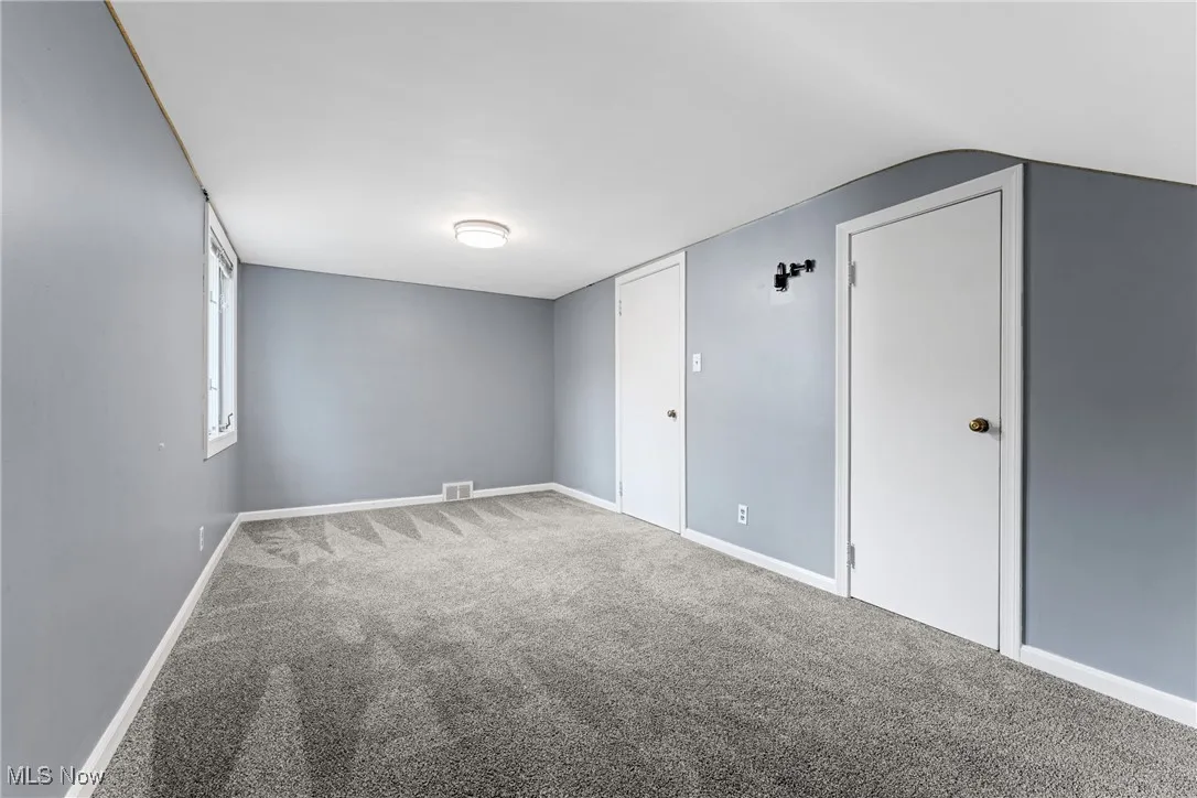 Unfurnished bedroom 3 with carpet and baseboards