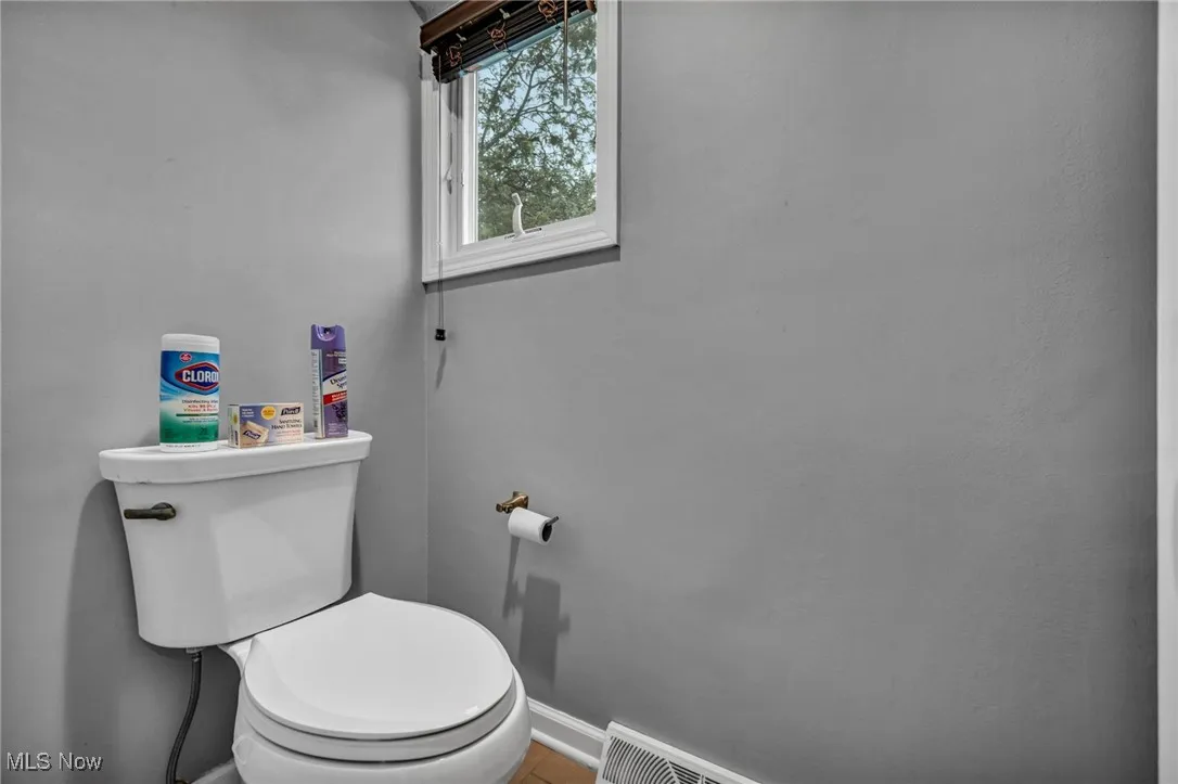 Bathroom featuring baseboards and tile patterned flooring
