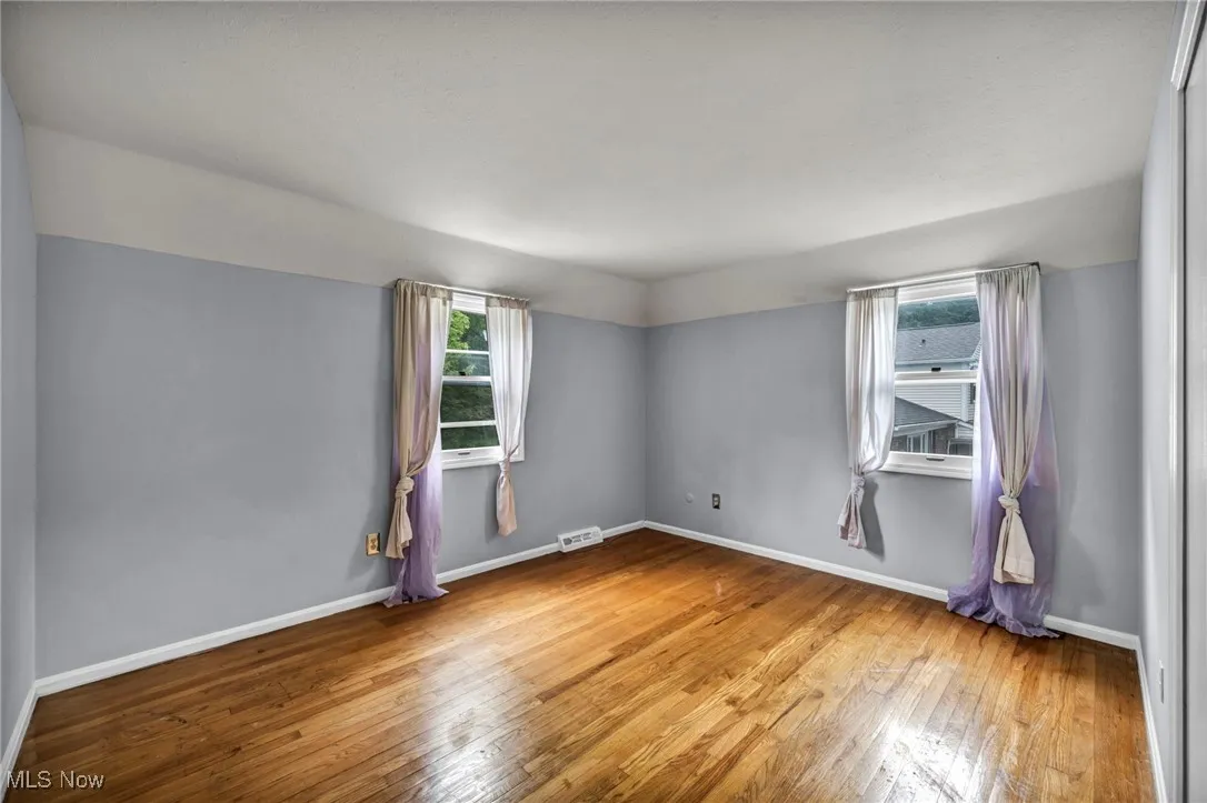 Empty room featuring light wood-style flooring