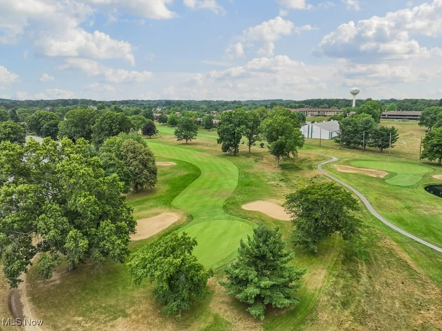 Aerial view of a golf club and a tree filled landscape