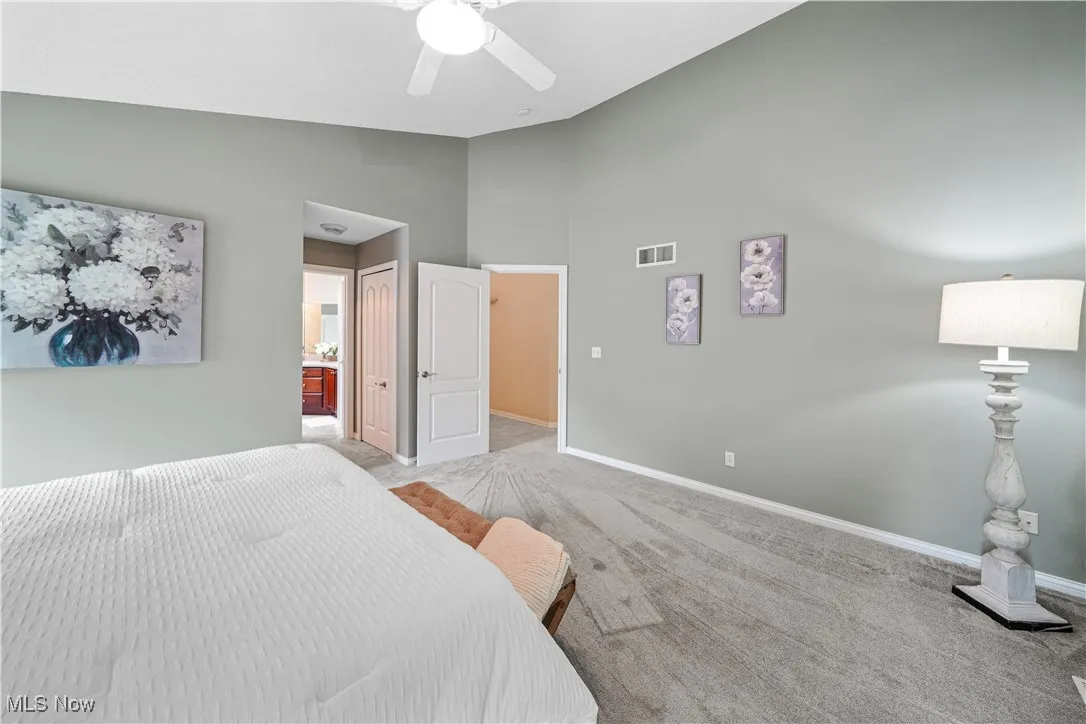 master bedroom with vaulted ceilings and great private wooded views.