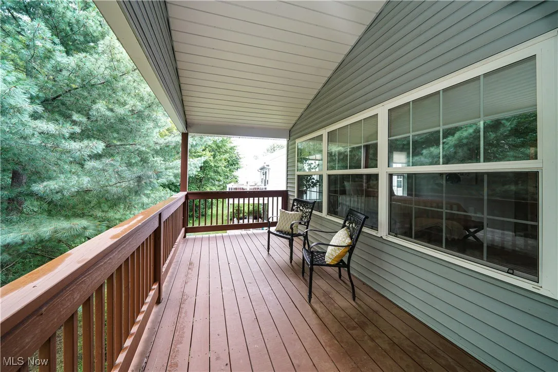 view of the first floor deck off the back of the home.