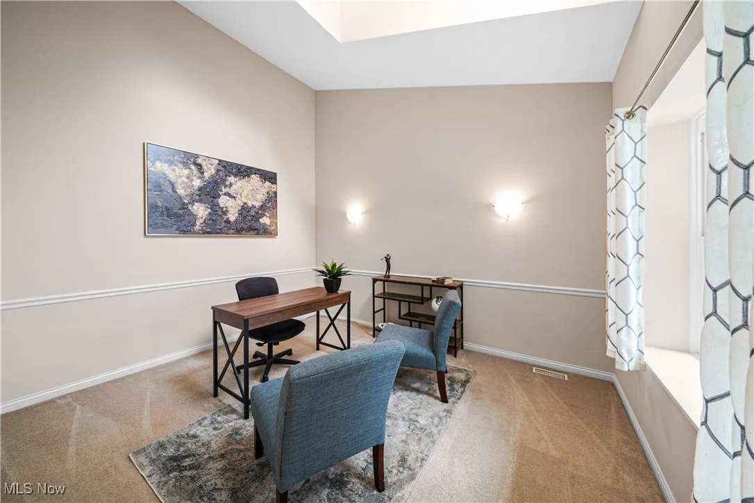 First floor office that could be bedroom or dining room.  Vaulted ceilings and large picture window.