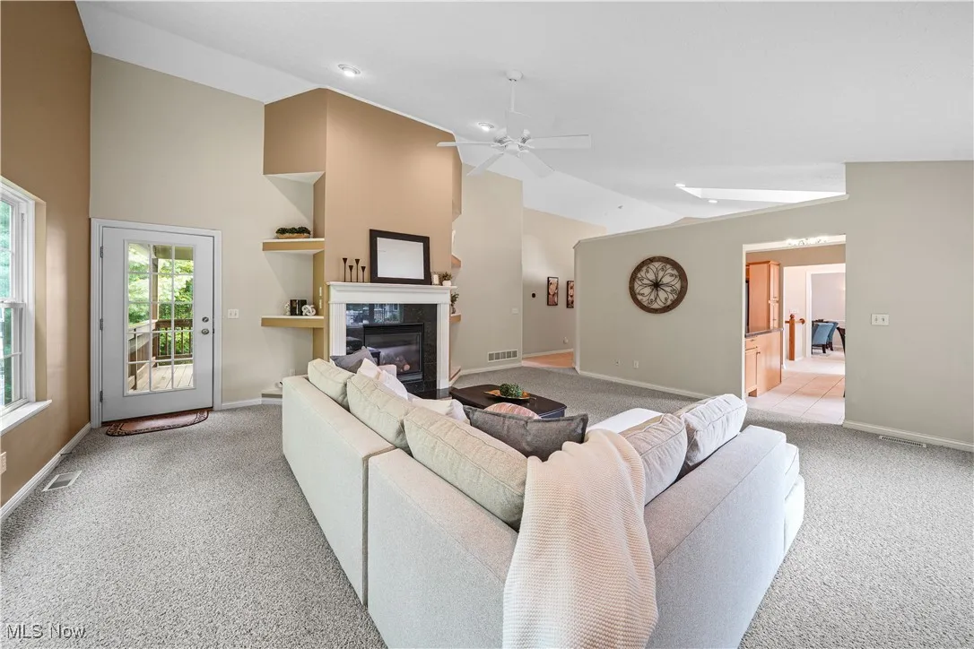 great room with gas fireplace and vaulted ceilings.  Beautiful views of the wooded back yard