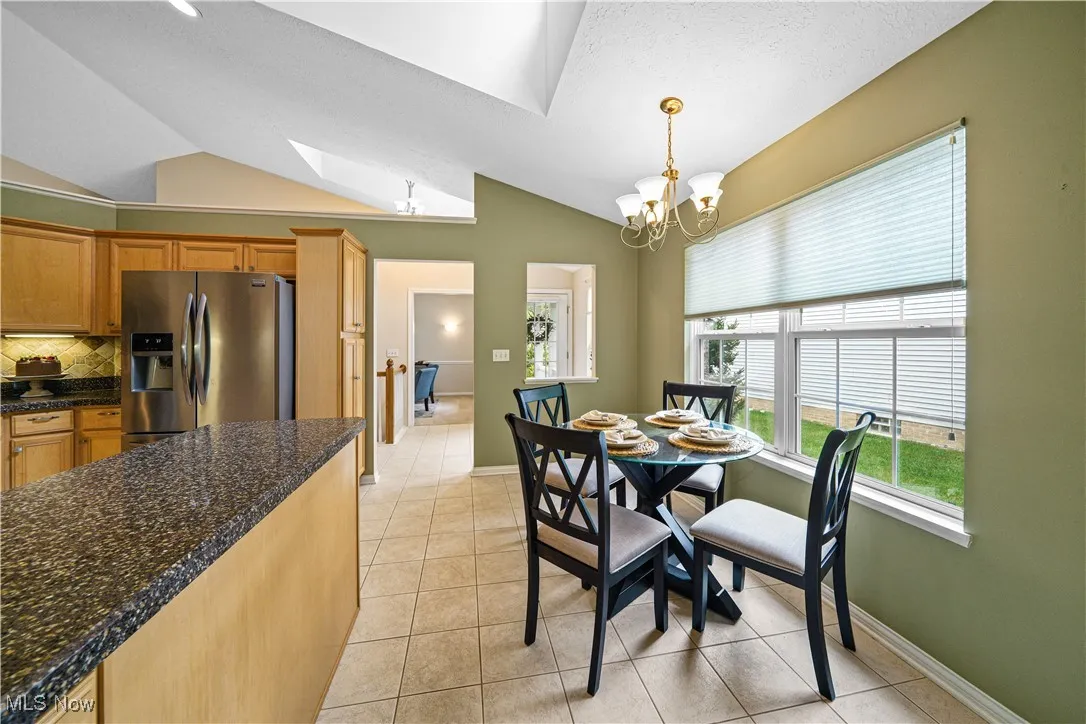 eat in kitchen with vaulted ceilings.